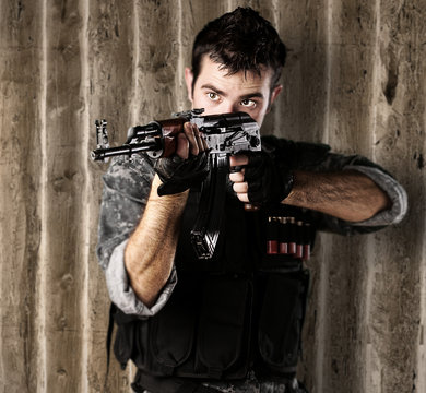 young soldier aiming