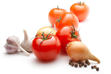 Tomatoes, onions, pepper and garlic on white background.