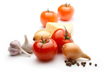 Tomatoes, cheese, onions, pepper and garlic on white background