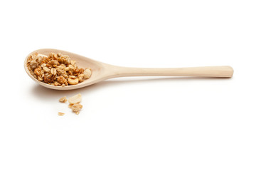 Spoon full of muesli on the white background