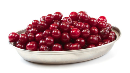 Bowl with ripe cherries. Isolated on a white background.