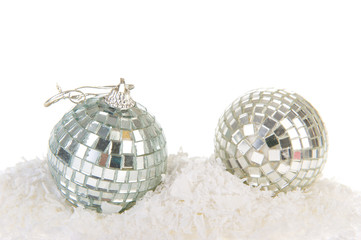 Silver Christmas balls in snow