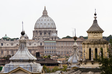 Fototapeta premium Dome of St. Peter's Basilica and other churches of Rome.