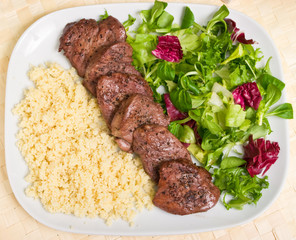 Tenderloin steaks in wine souce with kardamon and kuskus groats