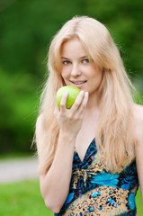 Beautiful woman with green apple