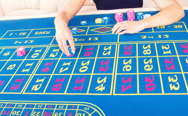 Casino player doing a bet