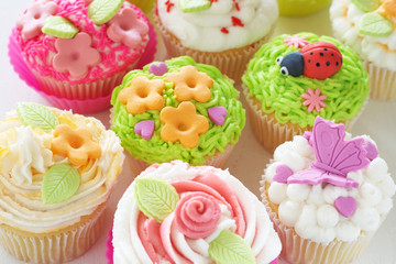 Vanilla cupcakes with various decorations