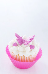 Vanilla cupcake with butterfly decorations