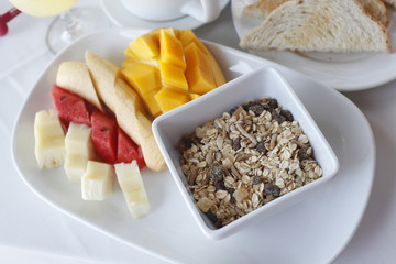 Healthy breakfast with cereal muesli and assortment of fresh fru