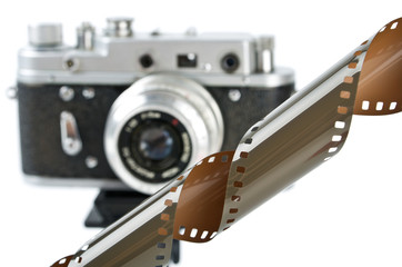 Photo film with retro camera over white