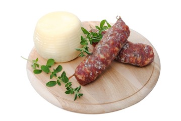 Italian salami and cheese on wooden cutting board