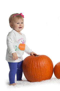 Baby Girl with Pumpkin