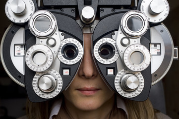 Optometrist diopter with girl.