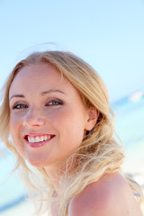 Portrait of beautiful woman in bikini at the beach