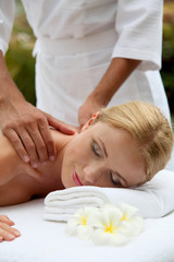 Obraz na płótnie Canvas Beautiful woman having a massage on her back