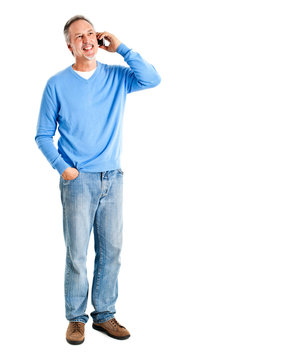 Full Length Man Talking At The Phone Isolated On White