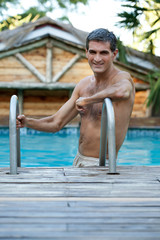 Man Standing in Pool