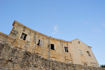 Fototapeta na wymiar Walls of an old ruined house