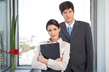 Female Worker Standing With Her Colleague