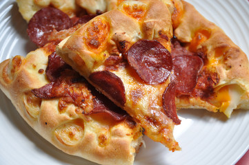 image of pizza sliced on the plate