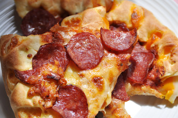image of pizza sliced on the plate