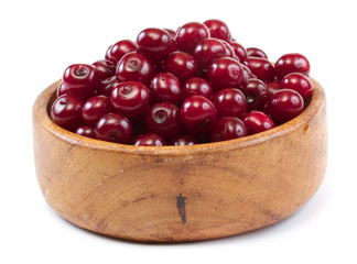 Bowl with ripe cherries. Isolated on a white background.
