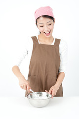 attractive asian woman cooking
