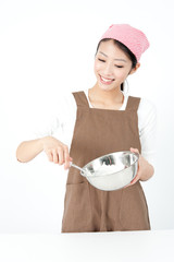 attractive asian woman cooking