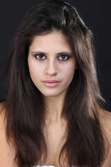 Fototapeta premium Beautiful young woman in grey background