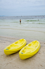 yellow canoes on the beach