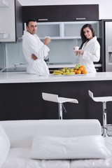 young couple have fun in modern kitchen
