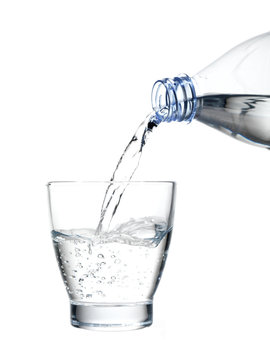 pouring mineral water in a water glass