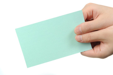 Fototapeta premium Empty light green business card in a woman's hand