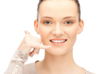 woman making a call me gesture