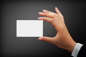 business white card in a woman hands