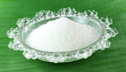 Fresh sugar on a transparent plate
