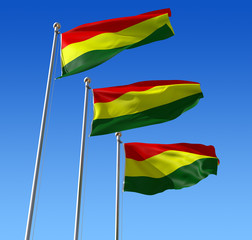 Obraz premium Three flags of Benin waving in the wind against blue sky.