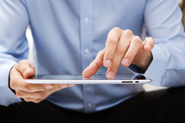 Young adult working on a digital tablet