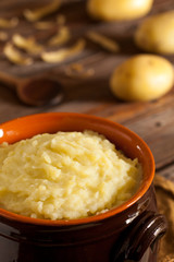 Mashed Potatoes in Terracotta Pot on Wood