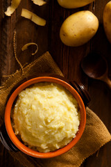 Mashed Potatoes in Terracotta Pot on Wood