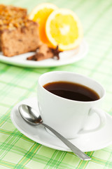 A cup of coffee or tea and gingerbread on the background