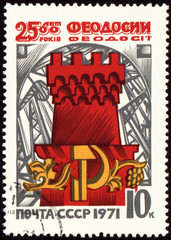 Ancient tower of Feodosiya town on post stamp