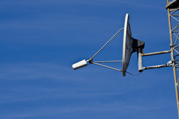 Fototapeta na wymiar Satellite Dish on Communications Tower