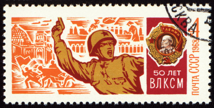 Soviet officer with a pistol in battle on postage stamp