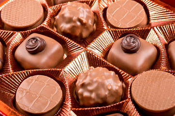 Box of praline candies close up