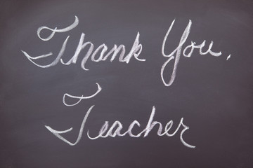 Thank you teacher written on a chalkboard