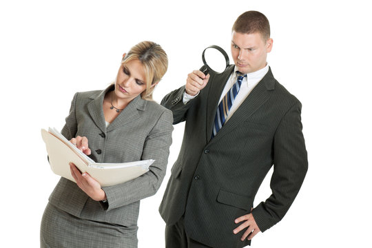 Business Man Spying On Business Woman With Magnifying Glass