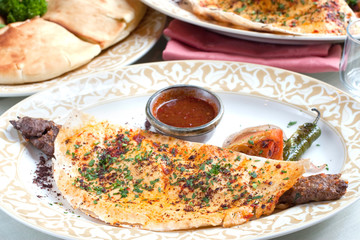 Middle Eastern Pita bread with rolled lamb