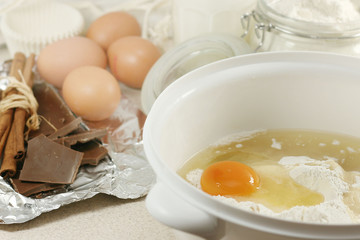 An egg in a pile of flour