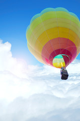 Fototapeta premium colorful hot air balloon with beautiful blue sky and cloud